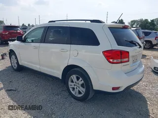 2012 Dodge Journey SXT z VIN 3C4PDCBB0CT323569, wystawiony jako IAAI lot #42748440 z przebiegiem 141 950 mil mil oraz . Historia ofert i sprzedaży dostępna na DreamBid. Obrazek 3.