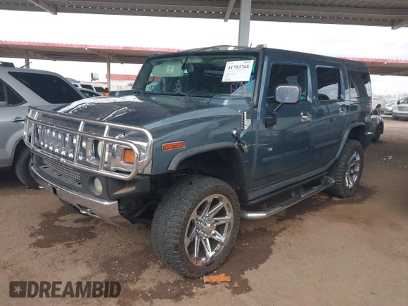 2005 Hummer H2 SUV with VIN 5GRGN23U25H107505, listed as a IAAI auction lot 41703768 with 213,723 mi miles. Bid and sale history available at carsss.com. Image 2.