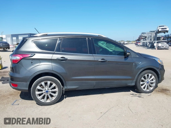 2018 Ford Escape Titanium with VIN 1FMCU0J99JUB09562, listed as a IAAI auction lot 41547659 with 63,700 mi miles and . Bid and sale history available at DreamBid. Image 13.