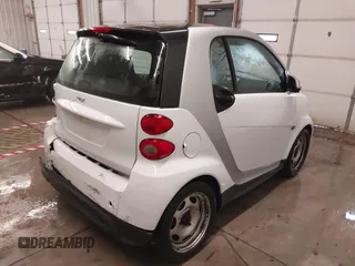 2015 Smart fortwo Passion z VIN WMEEJ3BA2FK790569, wystawiony jako IAAI lot #41598759 z przebiegiem 78 307 mil mil oraz . Historia ofert i sprzedaży dostępna na DreamBid. Obrazek 4.