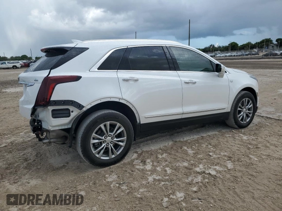 2022 Cadillac XT5 FWD Premium Luxury z VIN 1GYKNCRS0NZ175748, wystawiony jako Copart lot #61651885 z przebiegiem 13 747 mil mil oraz Szkoda całkowita • Salvage title. Historia ofert i sprzedaży dostępna na DreamBid. Obrazek 3.