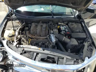 2012 Ford Fusion SE z VIN 3FAHP0HGXCR117692, wystawiony jako Copart lot #56026555 z przebiegiem 236 669 mil mil oraz Szkoda całkowita • Salvage title. Historia ofert i sprzedaży dostępna na DreamBid. Obrazek 11.