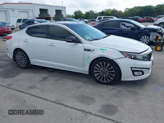 2015 Kia Optima SX Turbo with VIN 5XXGR4A60FG503940, listed as a IAAI auction lot 41944773 with 214,914 mi miles. Bid and sale history available at carsss.com. Image 1.