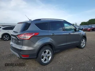 2014 Ford Escape SE z VIN 1FMCU9GX3EUE26446, wystawiony jako Copart lot #57113865 z przebiegiem 145 699 mil mil oraz Szkoda całkowita • Salvage title. Historia ofert i sprzedaży dostępna na DreamBid. Obrazek 3.