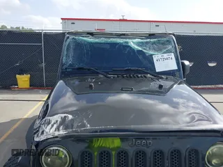 2014 Jeep Wrangler Unlimited Rubicon with VIN 1C4BJWFG0EL116026, listed as a IAAI auction lot 41729074 with 154,597 mi miles. Bid and sale history available at carsss.com. Image 6.