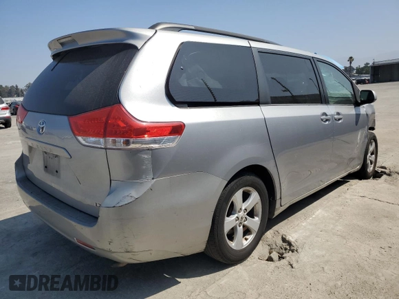 2012 Toyota Sienna LE AAS with VIN 5TDKK3DC2CS207404, listed as a Copart auction lot 62781215 with 200,757 mi miles and Salvage title. Bid and sale history available at DreamBid. Image 3.