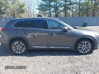 2019 Mazda CX-9 Grand Touring with VIN JM3TCBDY3K0307964, listed as a IAAI auction lot 41706594 with 170,596 mi miles and . Bid and sale history available at DreamBid. Image 13.