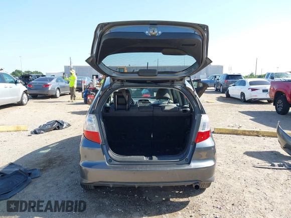 2013 Honda Fit with VIN JHMGE8H37DC048529, listed as a IAAI auction lot 42011202 with 255,113 mi miles. Bid and sale history available at carsss.com. Image 19.