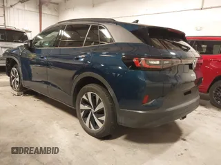 2023 Volkswagen ID.4 Pro z VIN 1V2DNPE84PC038042, wystawiony jako IAAI lot #41446269 z przebiegiem 12 878 mil mil oraz . Historia ofert i sprzedaży dostępna na DreamBid. Obrazek 3.