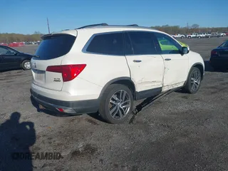 2017 Honda Pilot Elite with VIN 5FNYF6H00HB032386, listed as a IAAI auction lot 41976702 with 153,251 mi miles and . Bid and sale history available at DreamBid. Image 4.