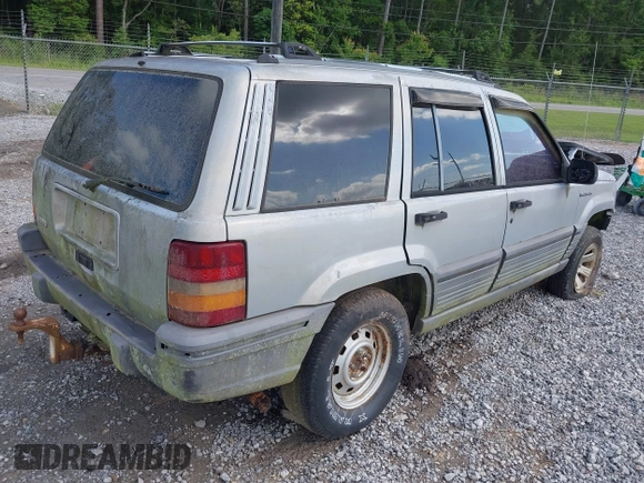 1995 Jeep Grand Cherokee Laredo with VIN 1J4GZ58S6SC756256, listed as a IAAI auction lot 42169534 with 255,516 mi miles. Bid and sale history available at carsss.com. Image 4.