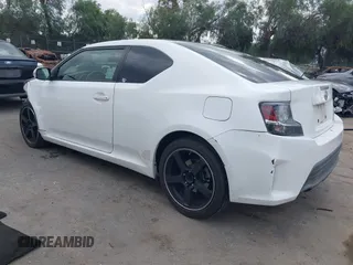 2014 Scion tC with VIN JTKJF5C79E3075707, listed as a IAAI auction lot 41557310 with 132,468 mi miles. Bid and sale history available at carsss.com. Image 3.