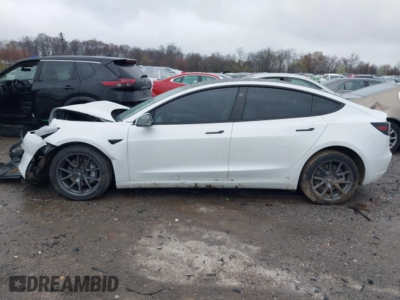 2022 Tesla Model 3 Long Range with VIN 5YJ3E1EB0NF129945, listed as a IAAI auction lot 41965531 with 59,162 mi miles and . Bid and sale history available at DreamBid. Image 14.