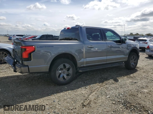 2023 Ford F-150 Lightning Pro z VIN 1FT6W1EV4PWG42053, wystawiony jako Copart lot #50003045 z przebiegiem 29 320 mil mil oraz Szkody całkowita. Historia ofert i sprzedaży dostępna na DreamBid. Obrazek 3.