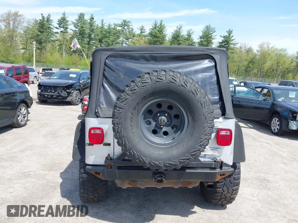 2003 Jeep Wrangler Sport z VIN 1J4FA49S73P302278, wystawiony jako IAAI lot #42219582 z przebiegiem 129 089 mil mil oraz . Historia ofert i sprzedaży dostępna na DreamBid. Obrazek 16.
