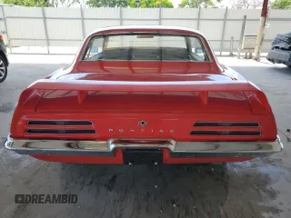 1969 Pontiac Firebird z VIN 223379ULL6573, wystawiony jako Copart lot #57812295 z przebiegiem 142 mil mil oraz Tytuł czysty. Historia ofert i sprzedaży dostępna na DreamBid. Obrazek 6.