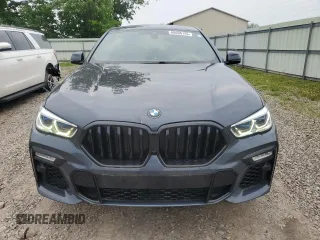 2021 BMW X6 M50i z VIN 5UXCY8C04M9D98591, wystawiony jako Copart lot #60606155 z przebiegiem 90 639 mil mil oraz Czysty tytuł • Clean title. Historia ofert i sprzedaży dostępna na DreamBid. Obrazek 5.