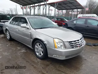 2007 Cadillac DTS Luxury I z VIN 1G6KD57YX7U167297, wystawiony jako IAAI lot #41364676 z przebiegiem 142 661 mil mil oraz . Historia ofert i sprzedaży dostępna na DreamBid. Obrazek 1.