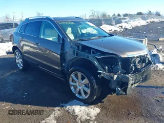 2016 Cadillac SRX Premium Collection z VIN 3GYFNDE39GS501021, wystawiony jako IAAI lot #41346296 z przebiegiem 79 193 mil mil oraz . Historia ofert i sprzedaży dostępna na DreamBid. Obrazek 1.