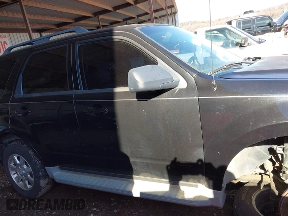 2011 Mazda Tribute Sport with VIN 4F2CY9C7XBKM06202, listed as a IAAI auction lot 41281197 with 195,443 mi miles and . Bid and sale history available at DreamBid. Image 12.