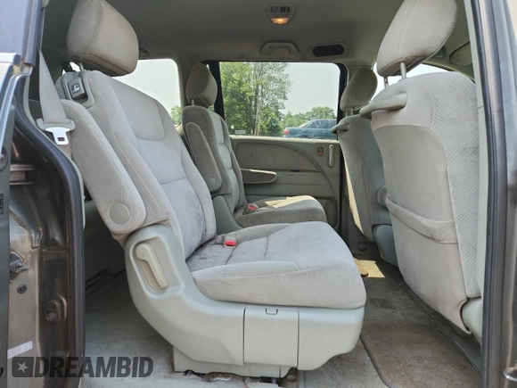 2007 Honda Odyssey LX z VIN 5FNRL38257B011710, wystawiony jako Copart lot #61163265 z przebiegiem 196 575 mil mil oraz Czysty tytuł • Clean title. Historia ofert i sprzedaży dostępna na DreamBid. Obrazek 11.