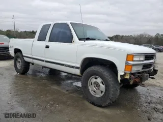 1990 Chevrolet C/K 2500 with VIN 2GCFK29K5L1177737, listed as a Copart auction lot 43911515 with 329,501 mi miles and Salvage Title. Bid and sale history available at carsss.com. Image 4.