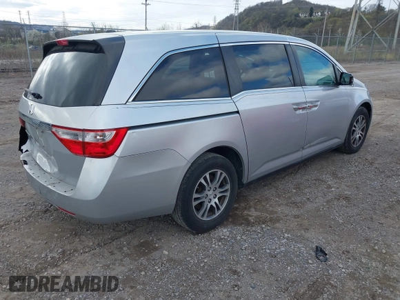 2011 Honda Odyssey EX-L with VIN 5FNRL5H60BB012206, listed as a IAAI auction lot 41982987 with 220,913 mi miles and . Bid and sale history available at carsss.com. Image 4.