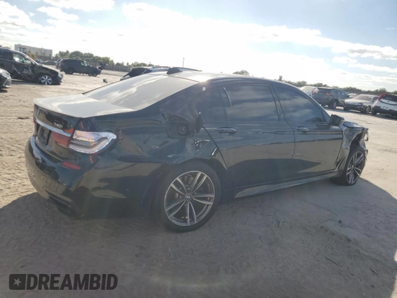 2017 BMW 7 Series 740i with VIN WBA7E2C51HG739462, listed as a Copart auction lot 84157364 with 137,881 mi miles and Salvage Title. Bid and sale history available at carsss.com. Image 3.