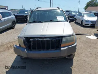 2004 Jeep Grand Cherokee Laredo z VIN 1J4GW48SX4C283922, wystawiony jako IAAI lot #42306869 z przebiegiem 263 812 mil mil oraz . Historia ofert i sprzedaży dostępna na DreamBid. Obrazek 6.