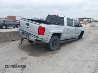 2015 Chevrolet Silverado 1500 LT with VIN 3GCUKREC8FG490856, listed as a IAAI auction lot 42067589 with 121,120 mi miles. Bid and sale history available at carsss.com. Image 4.