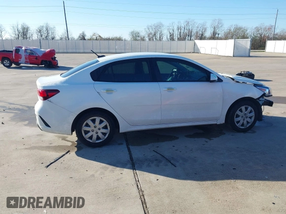 2023 Kia Rio S z VIN 3KPA24AD9PE567364, wystawiony jako IAAI lot #41145615 z przebiegiem 82 143 mil mil oraz . Historia ofert i sprzedaży dostępna na DreamBid. Obrazek 13.