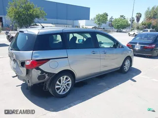 2012 Mazda Mazda5 Sport with VIN JM1CW2BL4C0103408, listed as a IAAI auction lot 42087883 with 219,601 mi miles. Bid and sale history available at carsss.com. Image 4.