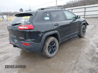 2016 Jeep Cherokee Trailhawk with VIN 1C4PJMBS6GW113069, listed as a IAAI auction lot 41757725 with 125,029 mi miles. Bid and sale history available at carsss.com. Image 4.