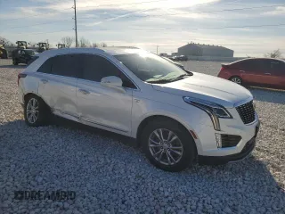 2022 Cadillac XT5 FWD Premium Luxury with VIN 1GYKNCRS1NZ125487, listed as a Copart auction lot 42081675 with 67,702 mi miles and Salvage title. Bid and sale history available at DreamBid. Image 4.