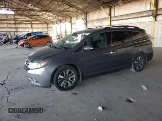 2014 Honda Odyssey Touring with VIN 5FNRL5H99EB111525, listed as a Copart auction lot 61986005 with 137,905 mi miles and Salvage title. Bid and sale history available at DreamBid. Image 1.