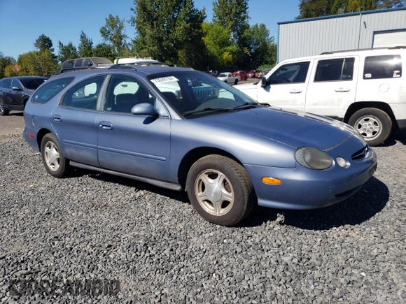 1999 Ford Taurus SE Standard with VIN 1FAFP58U9XG271897, listed as a Copart auction lot 73048784 with 190,518 mi miles and Salvage title. Bid and sale history available at DreamBid. Image 4.