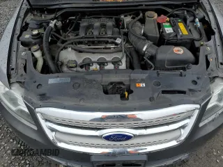 2012 Ford Taurus SEL z VIN 1FAHP2HW8CG124425, wystawiony jako Copart lot #50686415 z przebiegiem 172 480 mil mil oraz Szkoda całkowita • Salvage title. Historia ofert i sprzedaży dostępna na DreamBid. Obrazek 11.