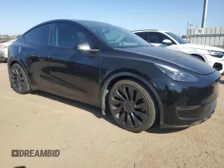 2022 Tesla Model Y Performance with VIN 7SAYGDEF1NF486218, listed as a Copart auction lot 63127435 with 99,302 mi miles and Salvage title. Bid and sale history available at DreamBid. Image 4.