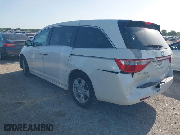 2012 Honda Odyssey Touring with VIN 5FNRL5H93CB125241, listed as a IAAI auction lot 42299053 with 125,549 mi miles and . Bid and sale history available at DreamBid. Image 3.