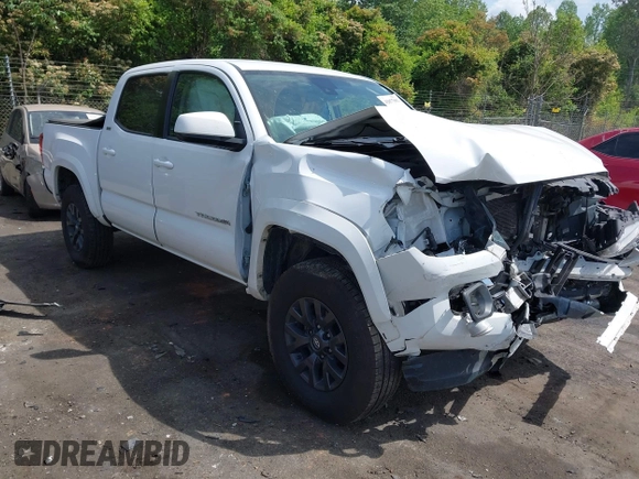 2021 Toyota Tacoma SR z VIN 5TFCZ5AN5MX265181, wystawiony jako IAAI lot #42077902 z przebiegiem 102 192 mil mil oraz . Historia ofert i sprzedaży dostępna na DreamBid. Obrazek 1.