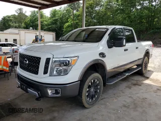 2016 Nissan Titan Platinum Reserve with VIN 1N6BA1F45GN517259, listed as a Copart auction lot 56902015 with 89,696 mi miles and Salvage title. Bid and sale history available at DreamBid. Image 1.