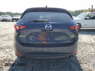 2018 Mazda CX-5 Grand Touring z VIN JM3KFADM5J1420690, wystawiony jako Copart lot #56897875 z przebiegiem 46 483 mil mil oraz Szkoda całkowita • Salvage title. Historia ofert i sprzedaży dostępna na DreamBid. Obrazek 6.
