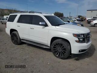 2018 Chevrolet Tahoe Premier with VIN 1GNSKCKC6JR195246, listed as a Copart auction lot 54887165 with 135,973 mi miles and Salvage title. Bid and sale history available at DreamBid. Image 4.
