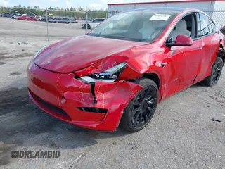 2023 Tesla Model Y Long Range with VIN 7SAYGDEE1PA154996, listed as a IAAI auction lot 41472595 with 24,861 mi miles and . Bid and sale history available at DreamBid. Image 6.
