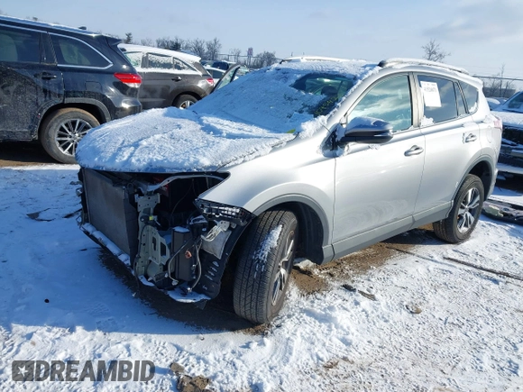 2018 Toyota RAV4 XLE with VIN 2T3RFREV8JW753853, listed as a IAAI auction lot 41526071 with 104,642 mi miles. Bid and sale history available at carsss.com. Image 18.