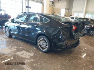 2014 Ford Fusion Titanium with VIN 3FA6P0K93ER115805, listed as a IAAI auction lot 41009602 with 136,021 mi miles. Bid and sale history available at carsss.com. Image 3.