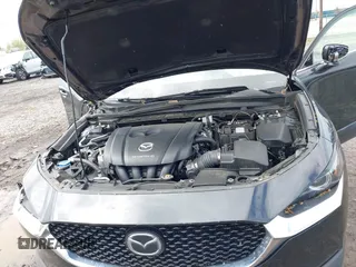 2022 Mazda CX-30 S Premium with VIN 3MVDMBDL5NM413878, listed as a IAAI auction lot 42189008 with 46,249 mi miles and . Bid and sale history available at DreamBid. Image 10.