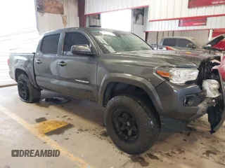 2023 Toyota Tacoma 4WD SR with VIN 3TMCZ5AN6PM562177, listed as a IAAI auction lot 41554858 with 55,542 mi miles. Bid and sale history available at carsss.com. Image 1.