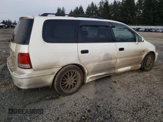 1998 Honda Odyssey with VIN RA31038664, listed as a Copart auction lot 43051785 with 106,084 mi miles and Salvage title. Bid and sale history available at DreamBid. Image 3.