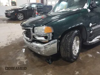 2004 GMC Yukon SLT with VIN 1GKEK13ZX4R198169, listed as a IAAI auction lot 41577015 with 169,562 mi miles. Bid and sale history available at carsss.com. Image 6.